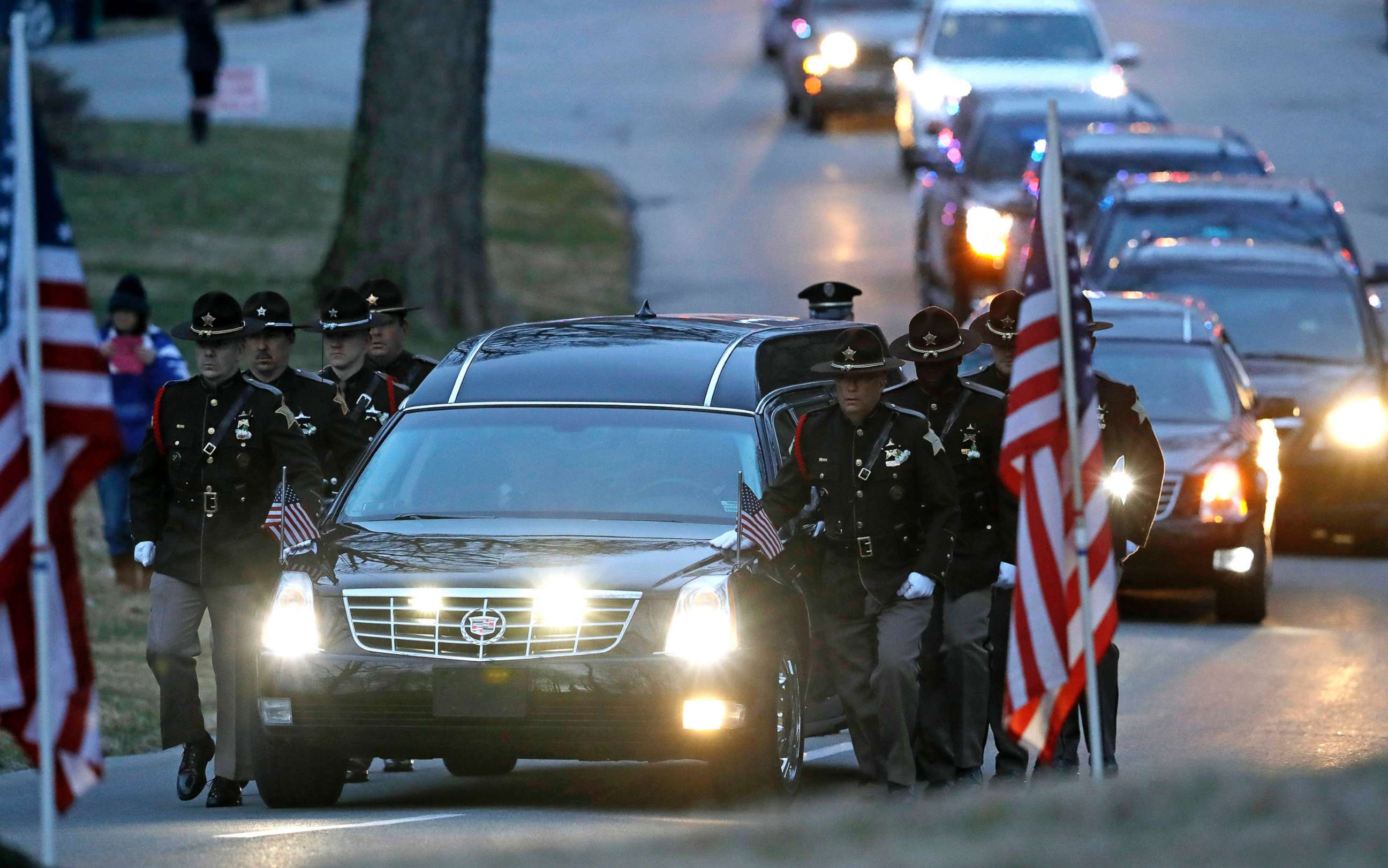 PHOTO: The honor guard walks along the hearse carrying the casket of Boone County Sheriff's Deputy Jacob Pickett, March 9, 2018, in Indianapolis. Pickett was fatally shot March 2, 2018, while chasing a man fleeing from police.