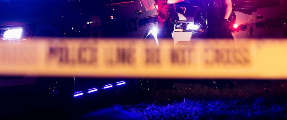 PHOTO: A stock photo show police car lights and crime scene tape.