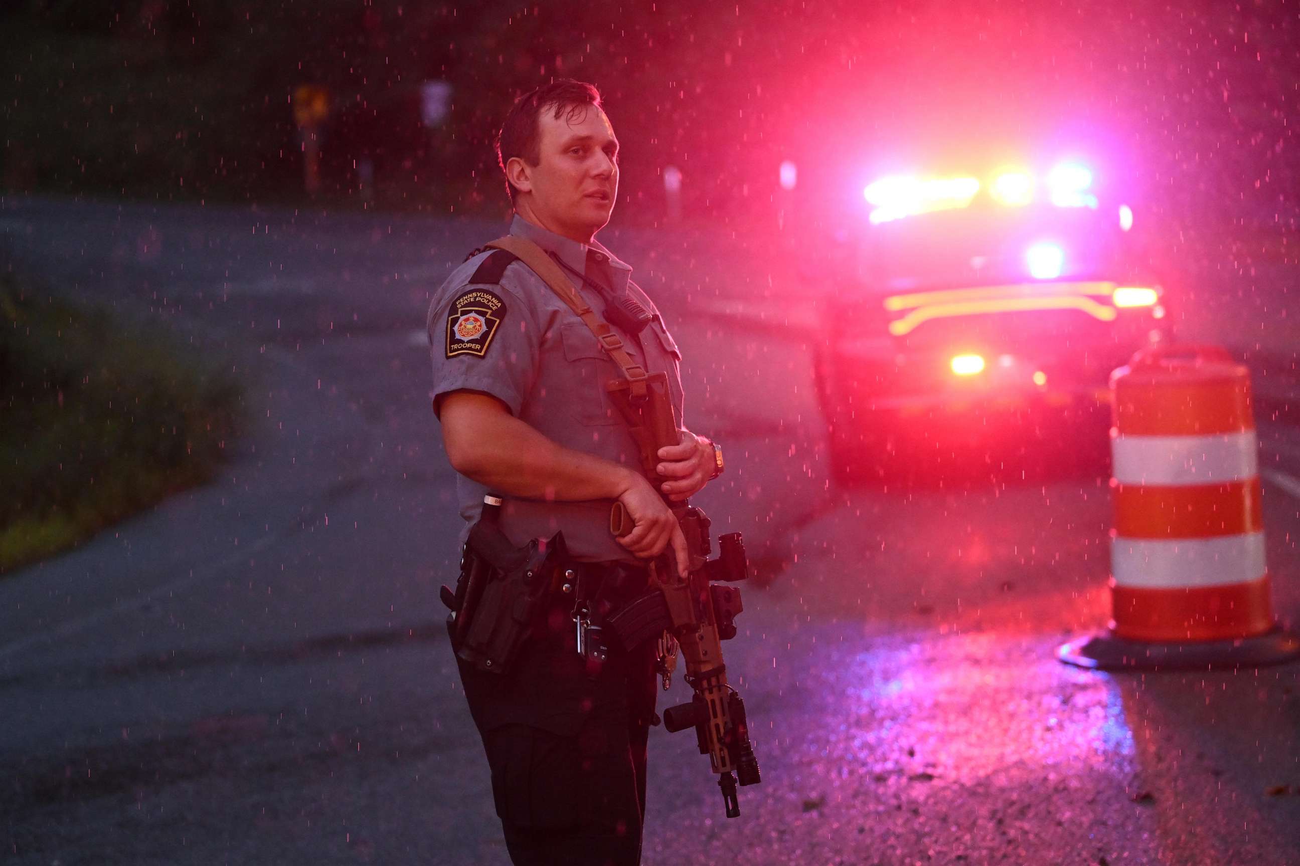 PHOTO: Police with rifles monitor a wooded perimeter in the rain on day 10 of a manhunt for convicted murderer Danelo Cavalcante on Sept. 9, 2023, in Kennett Square, Pennsylvania. Cavalcante escaped from Chester County Prison on August 31.