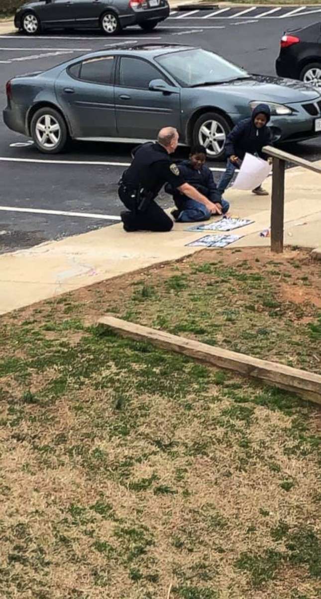 PHOTO: South Hill Police Cpl. C.B. Fleming was seen playing dolls and drawing with sidewalk chalk with children after he responded to a 911 call of a gas leak that turned out to be a false alarm on Feb. 14, 2019.