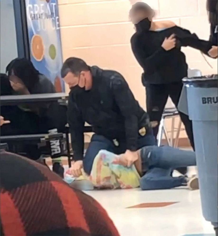 PHOTO: An off-duty police officer is pictured responding to a fight between two students at Lincoln Middle School in Kenosha, Wis., on March 4, 2022.