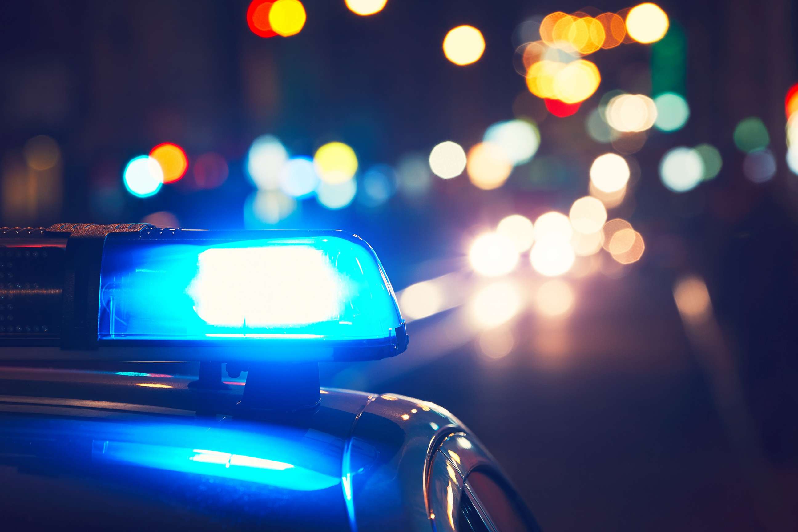 PHOTO: Police lights on a street at night.