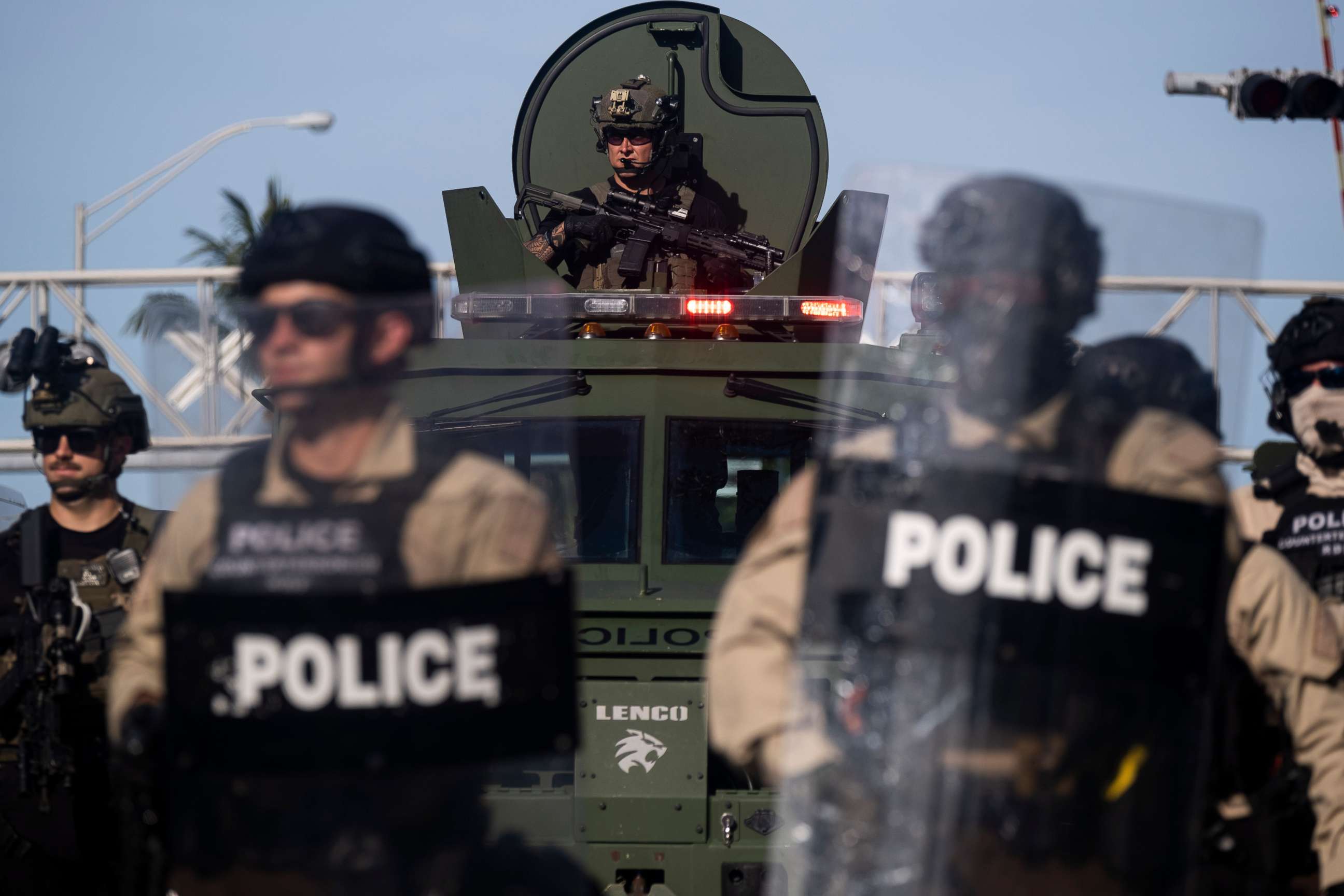 PHOTO: A Miami Police officer watches protestors from a armored vehicle during a rally in response to the recent death of George Floyd in Miami on May 31, 2020.