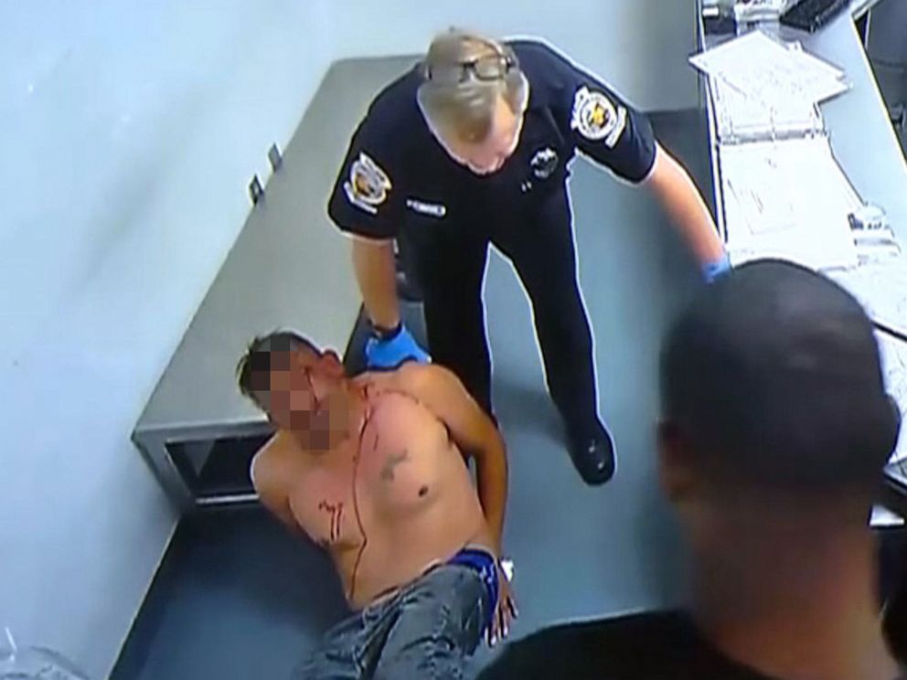 PHOTO: An image made from surveillance footage from inside the Homestead, Fla., police department shows Homestead Police officer Lester Brown pushing an inmate into a wall on Dec. 1, 2018.