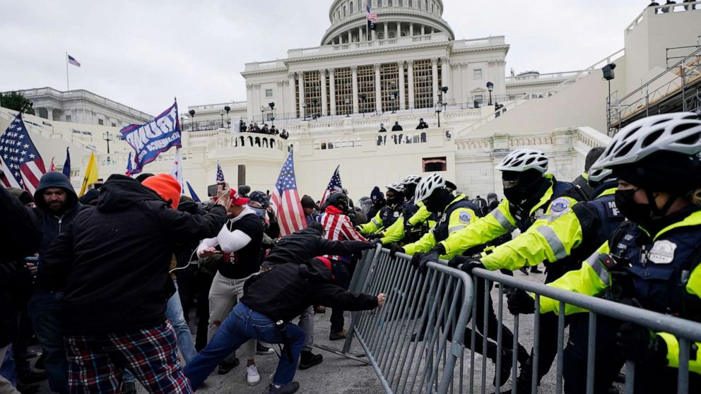 PHOTO: Supporters of U.S. President Donald Trump try to break through a police barrier at the U.S. Capitol in Washington, D.C., on Jan. 6, 2021.