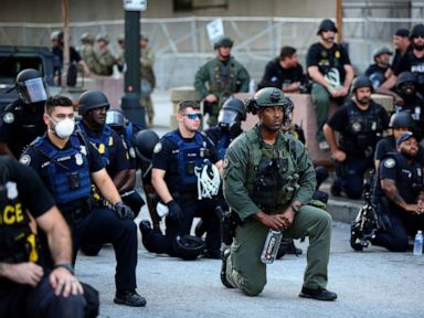 Some protesters take issue with police kneeling, calling it 'PR stunt'