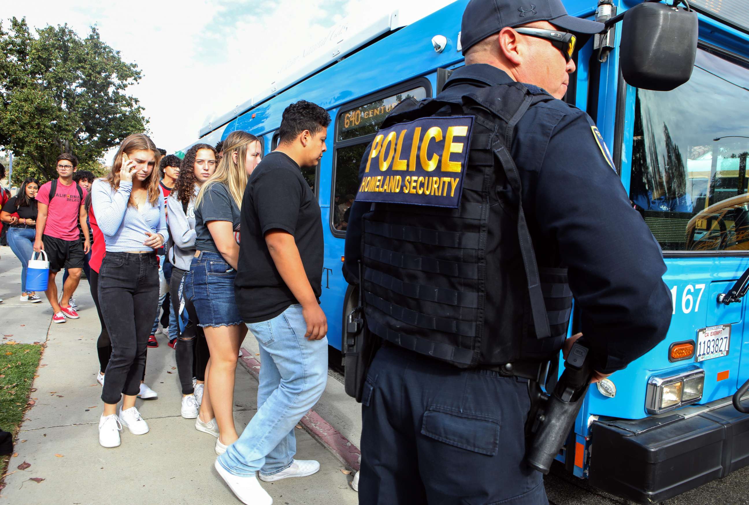 PHOTO: Students are evacuated from Saugus High School onto a bus after a shooting at the school left two students dead and three wounded on Nov. 14, 2019, in Santa Clarita, Calif.