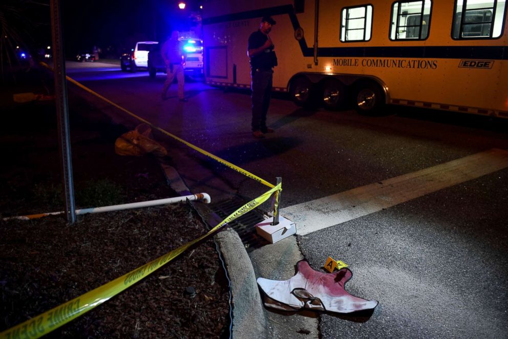 PHOTO: Blood - soaked evidence can be found on Saxon Drive, in the Vintage Place district, where several law enforcement personnel were shot dead, one of them deadly on October 3, 2018 in Florence, SC