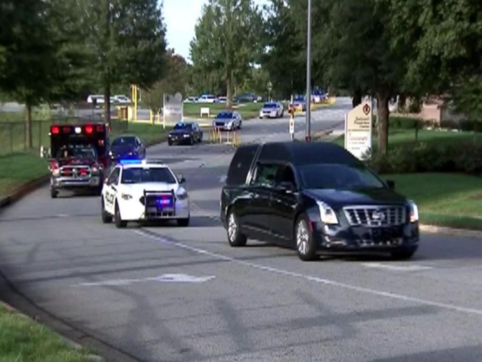 PHOTO: Gwinnett County, Georgia, police and paramedics escort a hearse carrying the body of officer Antwan Toney from a hospital where he died as a result of a gunshot wound at the office of Medical examiners from Gwinnett County on October 20, 2018.