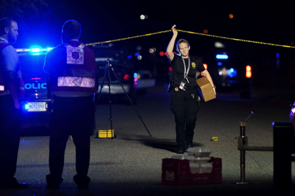 PHOTO: A member of the sheriff's department exits the crime scene on Ashton Drive in the Vintage Place neighborhood where several members of law enforcement were shot, one fatally, Oct. 3, 2018, in Florence, S.C.