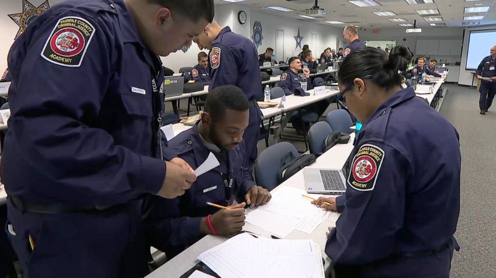 PHOTO: Police recruits attend a class at the Fairfax, Virginia police academy.