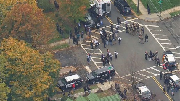 Police shooting suspect taken into custody after manhunt