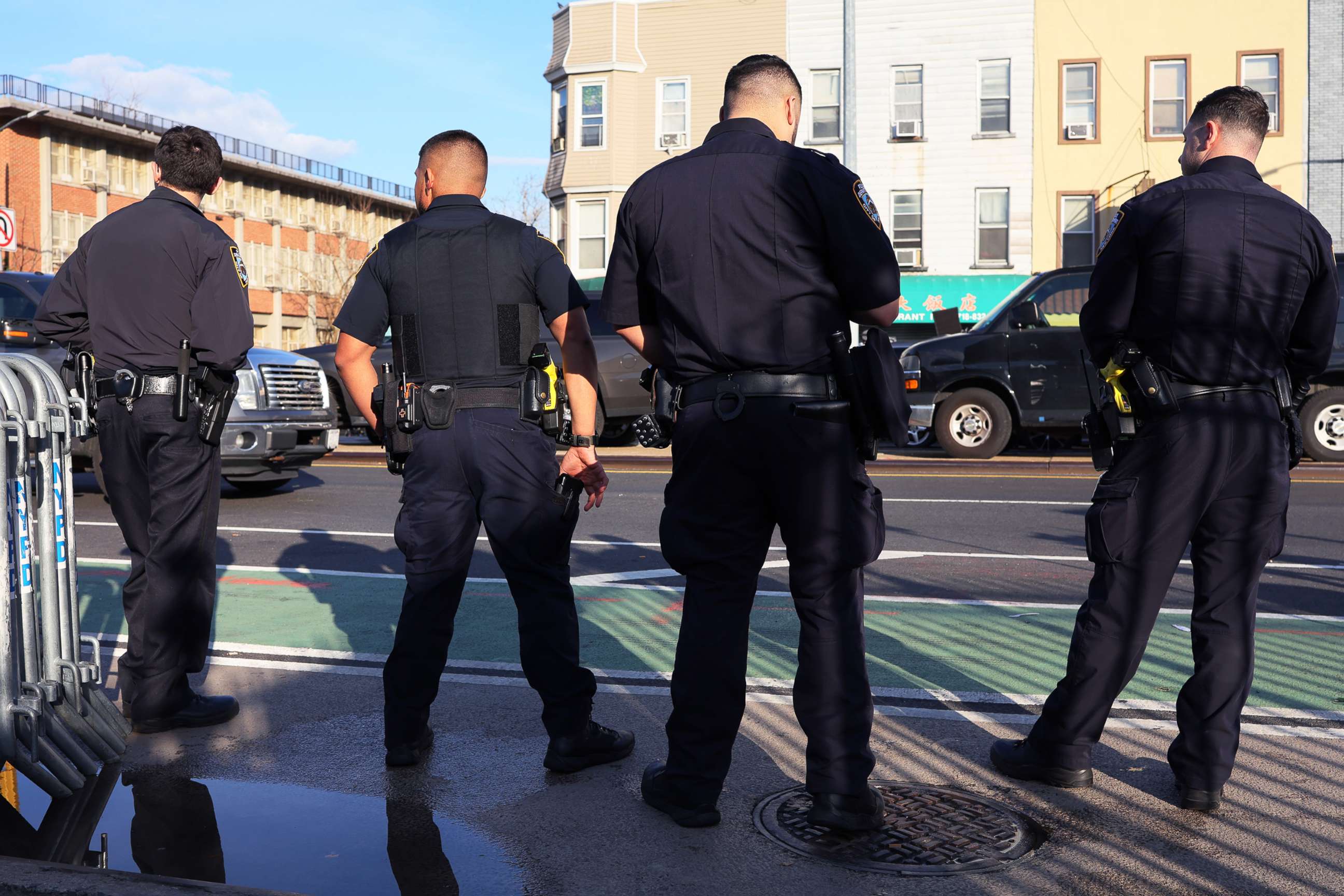 PHOTO: NYPD officers stand guard near the 36th Street subway station on April 13, 2022 in the Sunset Park neighborhood of Brooklyn in New York City. A manhunt is underway for a gunman who shot 10 people in the subway the previous day.