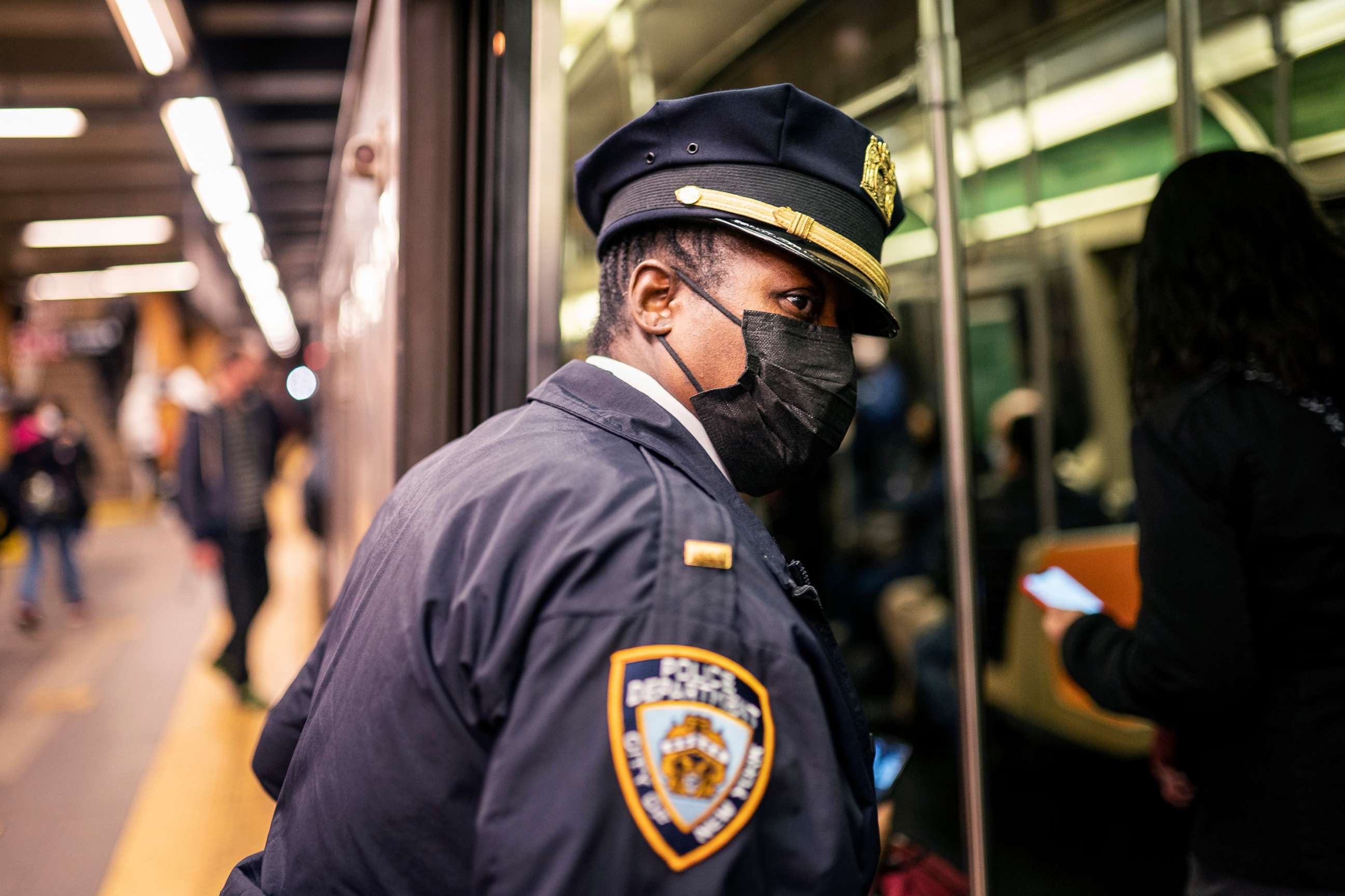 PHOTO: NYPD officers patrol platforms and train cars at the 36th Street subway station where a shooting attack occurred the previous day, April 13, 2022, in New York. 