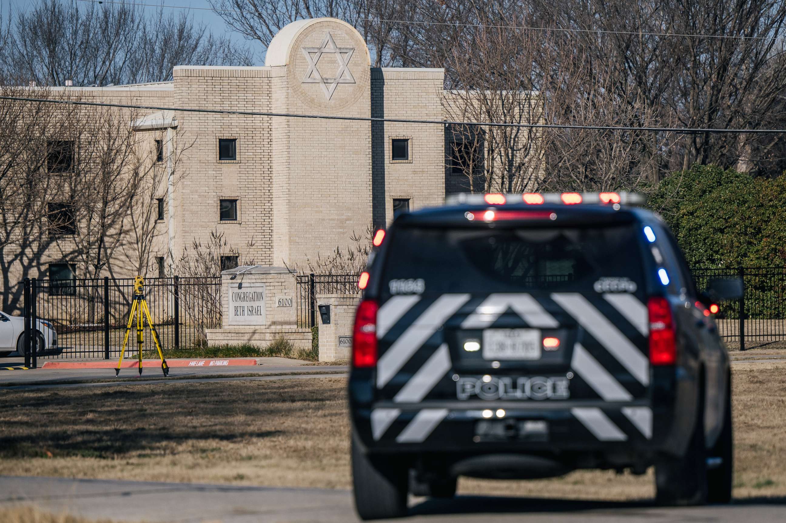 PHOTO: A law enforcement vehicle sits near the Congregation Beth Israel synagogue in Colleyville, Texas, on Jan. 16, 2022, where a gunman held four people hostage for more than 10 hours.