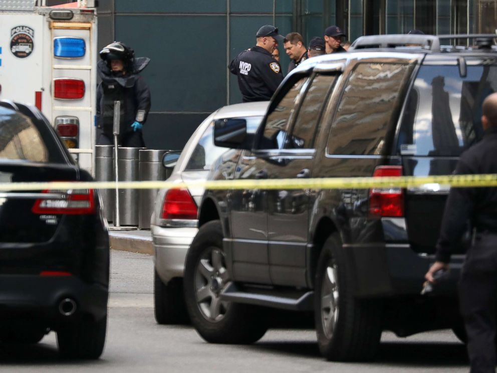 PHOTO: A member of the New York Police Department bomb squad is pictured outside the Time Warner Center in New York City after a suspicious package was found inside the CNN Headquarters.