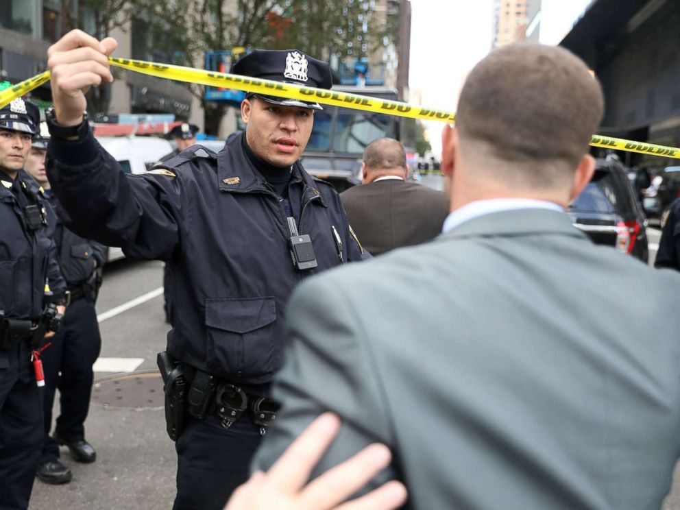 PHOTO: Police allow someone though the perimiter outside the Time Warner Center in the Manhattan borough of New York City after a suspicious package was found inside the CNN Headquarters in New York, Oct. 24, 2018.