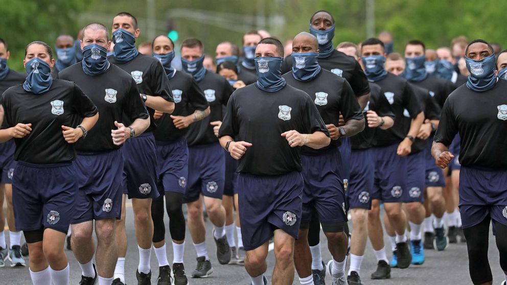 PHOTO: Boston Police recruits run on Columbus Ave, arriving at Boston Police Headquarters, May 29, 2020.