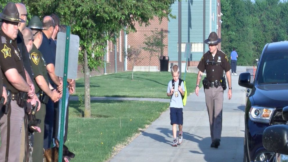Sea of blue: Boy escorted back to school by 70 police officers after ...