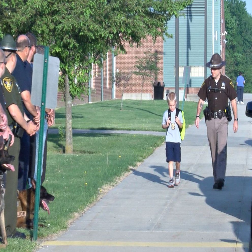 Sea of blue: Boy escorted back to school by 70 police officers after ...