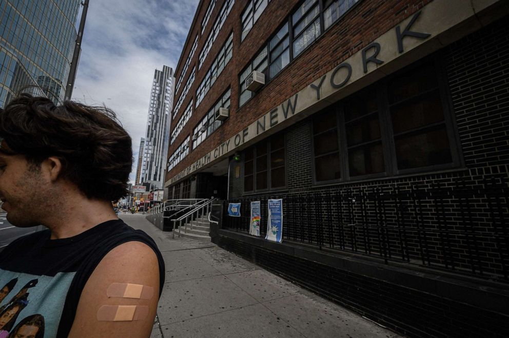 PHOTO: A man displays his arm where he received a polio vaccination at a health clinic in Brooklyn, New York on August 17, 2022.