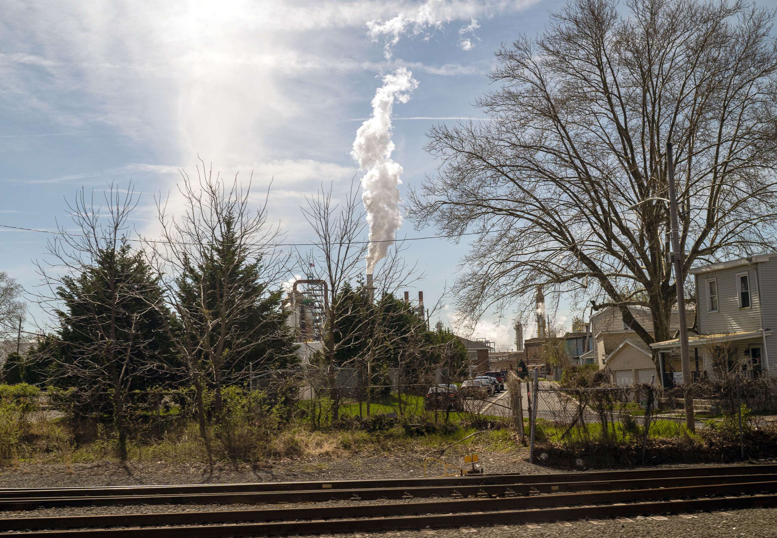 PHOTO: A plume of smoke rises above residential and commercial buildings from the Delaware City Refinery, on April 11, 2022 in New Castle, Dela.