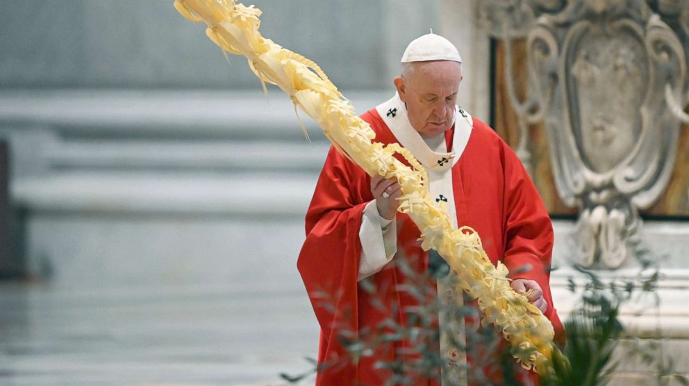 PHOTO: Pope Francis holds a palm branch as he celebrates Palm Sunday Mass behind closed doors in St. Peter's Basilica, at the Vatican, April 5, 2020, during the lockdown aimed at curbing the spread of the COVID-19 infection.