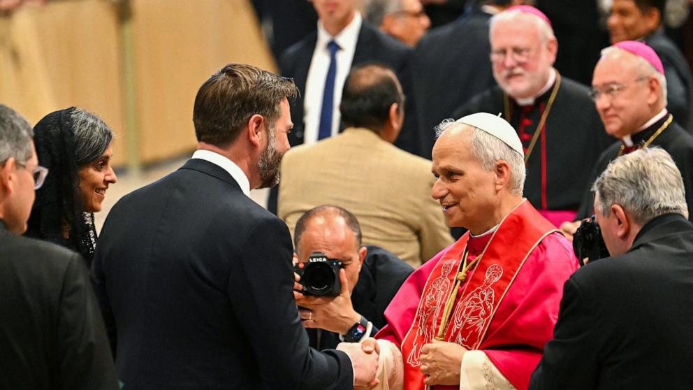 PHOTO: Pope Leo XIV talks to U.S. Vice President JD Vance and his wife Usha after a Holy mass for the beginning of his pontificate, in St Peter's basilica in The Vatican, May 18, 2025.