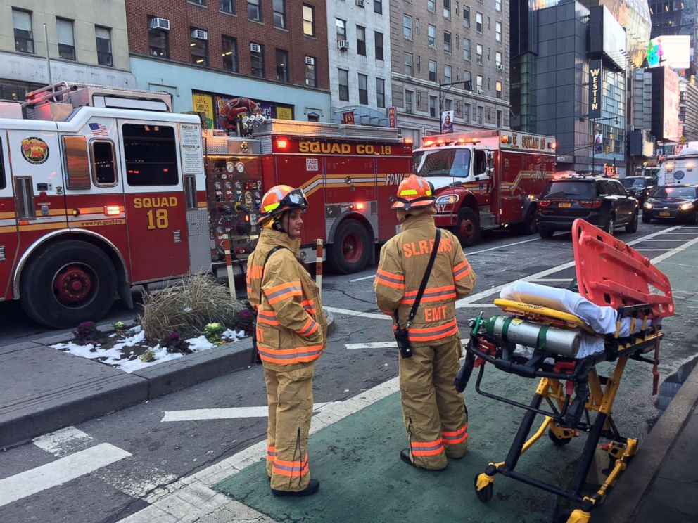 PHOTO: Emergency workers wait with a stretcher near the scene of a reported explosion near the Port Authority bus terminal, Dec. 11, 2017, in New York City. 