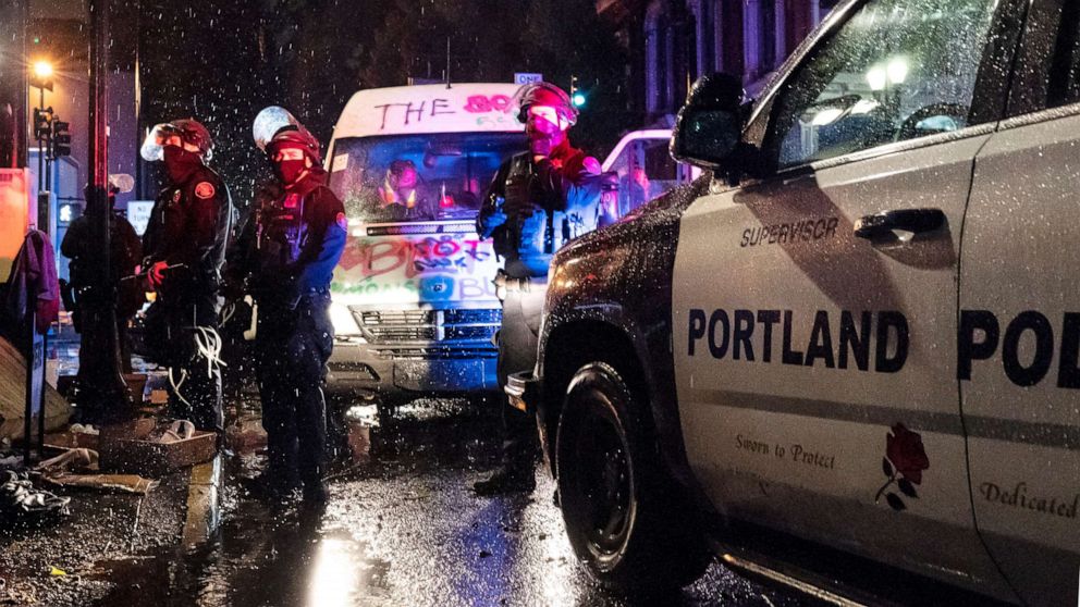 PHOTO: Police detain passengers riding a van during an Indigenous Peoples Day of Rage protest in Portland, Ore., Oct. 11, 2020.