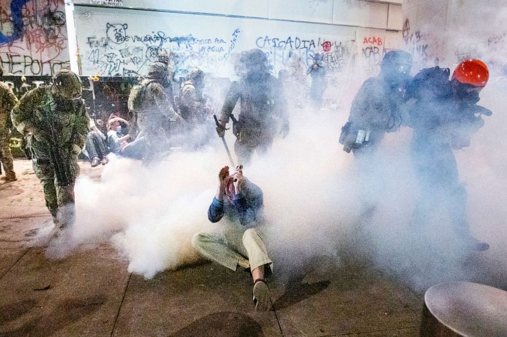 PHOTO: Federal officers use chemical irritants and crowd control munitions to disperse Black Lives Matter protesters outside the Mark O. Hatfield United States Courthouse, July 22, 2020, in Portland, Ore.