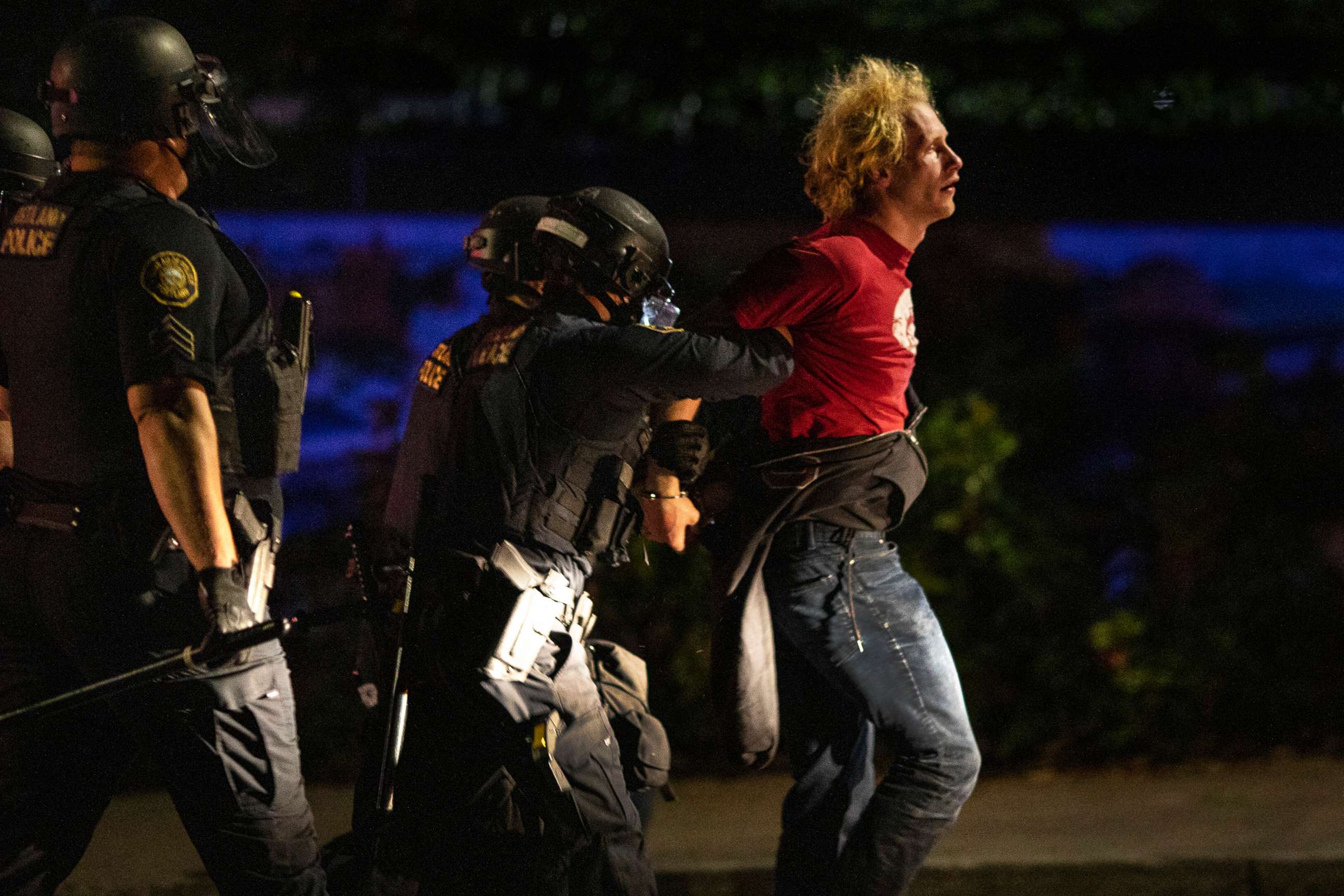 PHOTO: Portland police make arrests on the scene of the nightly protests at a Portland police precinct on Sunday, Aug. 30, 2020 in Portland, Ore. 