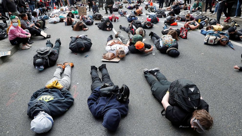 PHOTO: Protesters laying on the ground chant "I can't breathe" at a rally against the death in Minneapolis police custody of George Floyd, in Portland, Oregon, May 31, 2020.