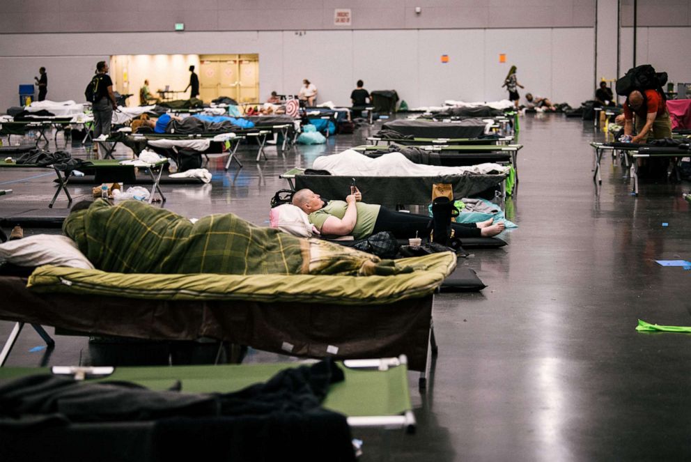 PHOTO: People rest at the Oregon Convention Center cooling station in Portland, OR, June 28, 2021, as a heatwave moves over much of the United States.