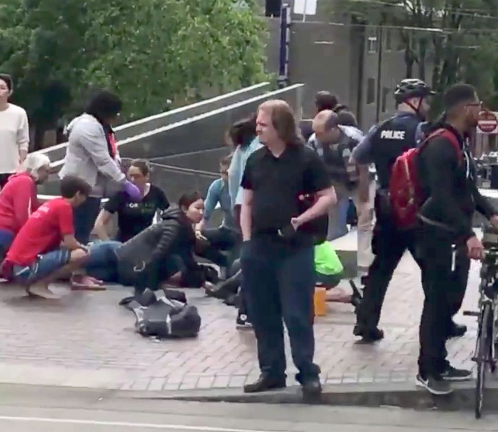 PHOTO: Police officer is seen among pedestrians after a hit-and-run incident at Portland State University, in Portland, Oregon, May 25, 2018 in a still image obtained from social media video.
