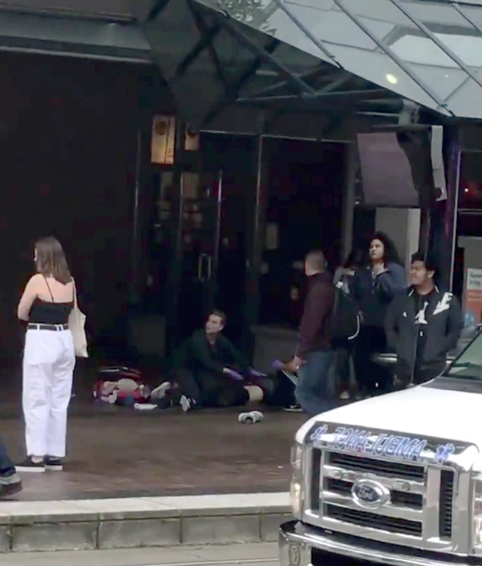 PHOTO: Police officer is seen among pedestrians after a hit-and-run incident at Portland State University, in Portland, Oregon, May 25, 2018 in a still image obtained from social media video.