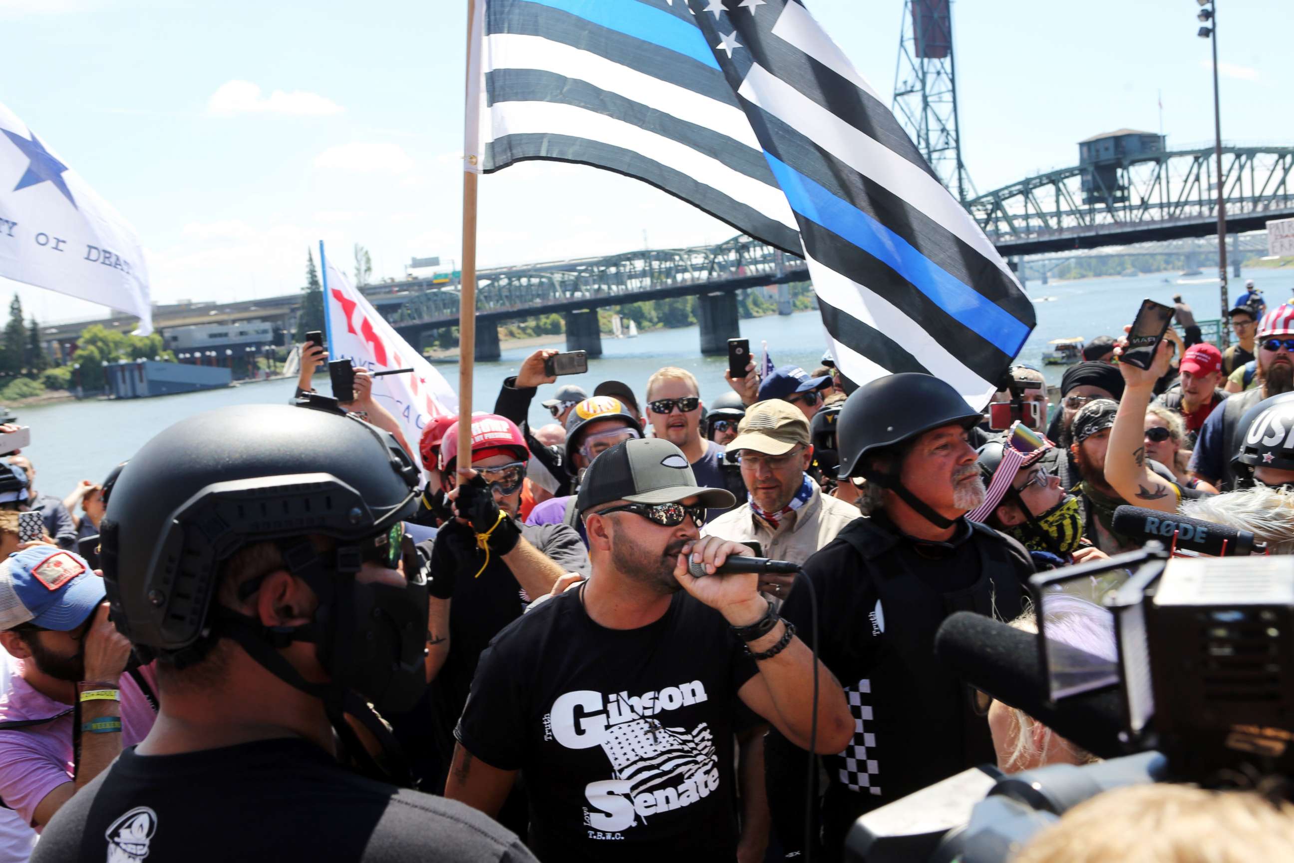 PHOTO: Joey Gibson, center, rally organizer and Patriot Prayer founder addresses alt-right activists in Portland, Oregon, August 4, 2018.