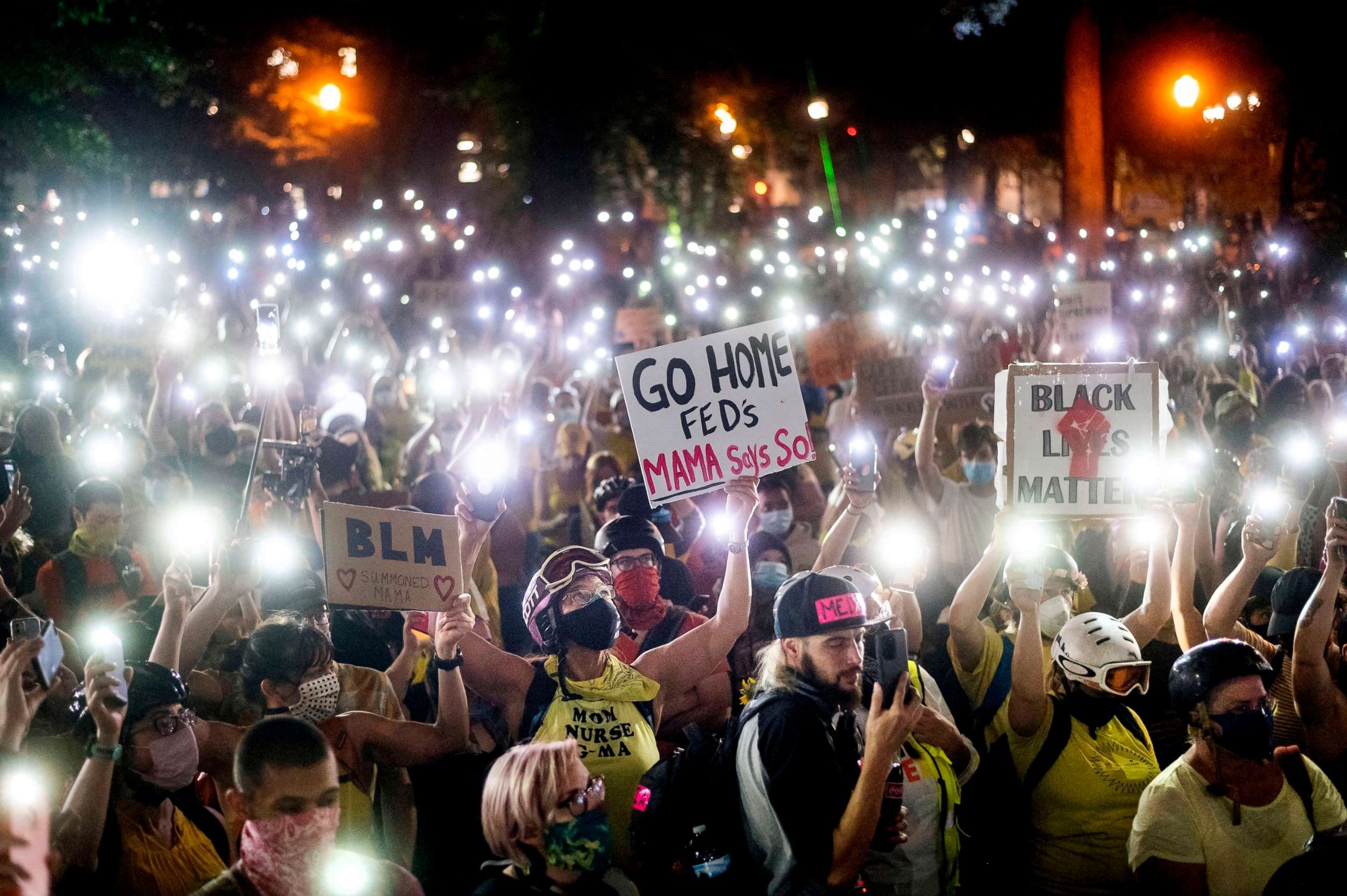 PHOTO: Hundreds of protesters hold their phones aloft in Portland, Ore., July 20, 2020.