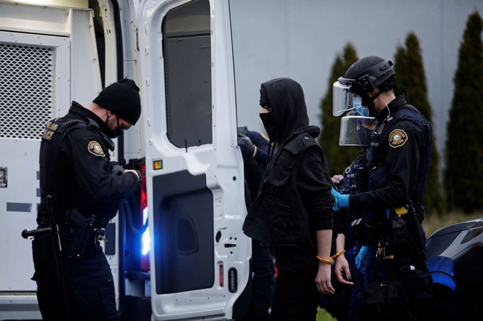 PHOTO: Police detain a person during a protest in Portland, Oregon, on Jan. 20, 2021, after the inauguration of President Joe Biden.