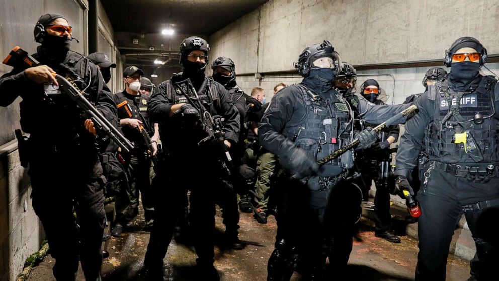 PHOTO: Police advance on protesters at the Justice Center after the full acquittal verdict of Kyle Rittenhouse in his Wisconsin fatal shootings trial, in Portland, Ore., Nov. 19, 2021.