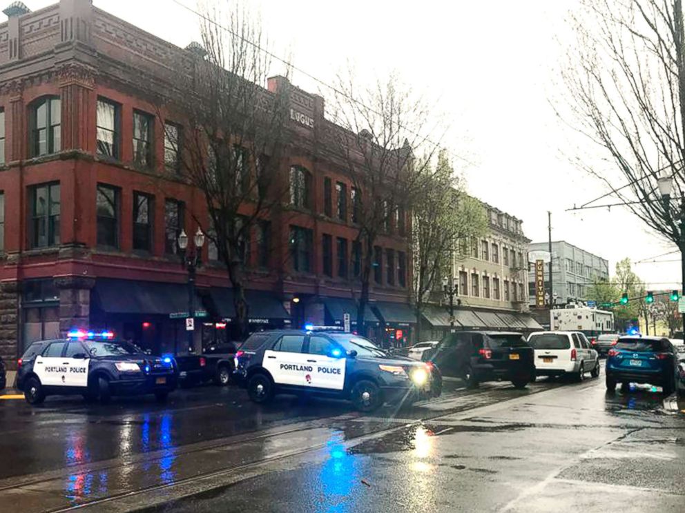 PHOTO: Portland police close a section of a street during an investigation into a shooting inside a homeless shelter in Portland, Ore., April 8, 2018.