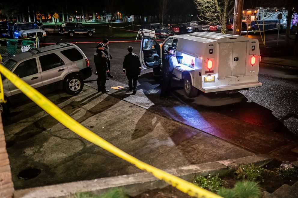 PHOTO: Police investigators working near Normandale Park in Portland, Oregon, where a shooting left one dead and five others injured, police said, Feb. 19, 2022.