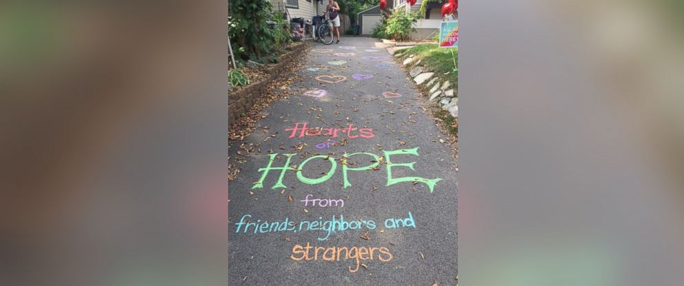 PHOTO: The front yard of Laura Stegenga's Minneapolis home was decorated with heart balloons by her mail carrier and neighbors.