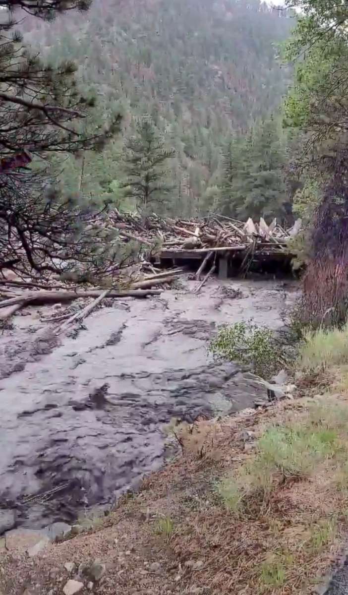 PHOTO: A video grab shows debris clogging a rain-swollen Poudre River in Colorado, July 20, 2021. 