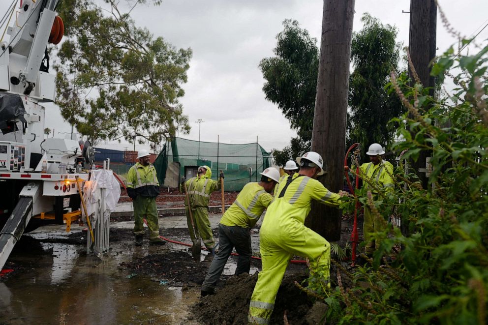 PHOTO: A power line pole is replaced on the East Side of Long Beach, California, August 20, 2023 as Tropical Storm Hilary arrives.