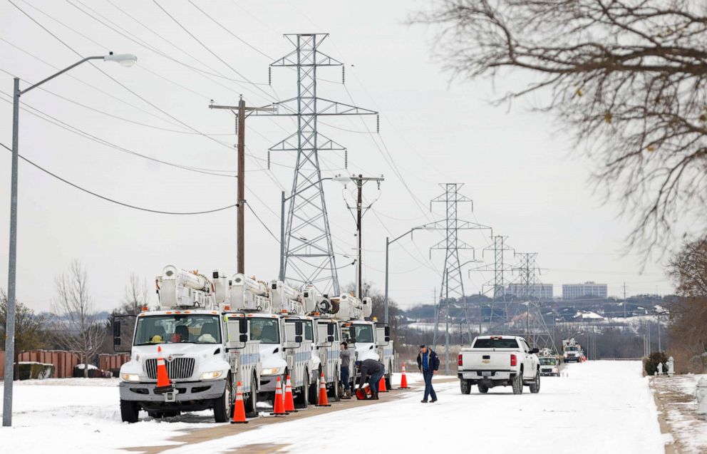 PHOTO: Pike Electric service trucks line up after a snow storm on Feb. 16, 2021 in Fort Worth, Texas. Winter storm Uri has brought historic cold weather and power outages to Texas. 