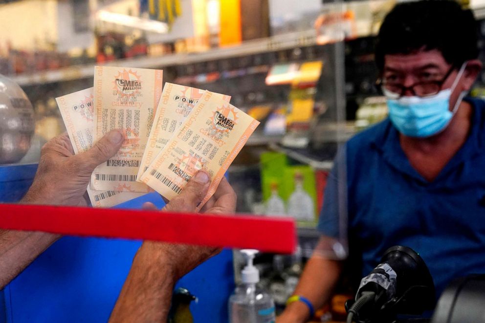 PHOTO: A person holds up their tickets purchased at a liquor store on Oct. 28, 2022, in Hawthorne, Calif. 