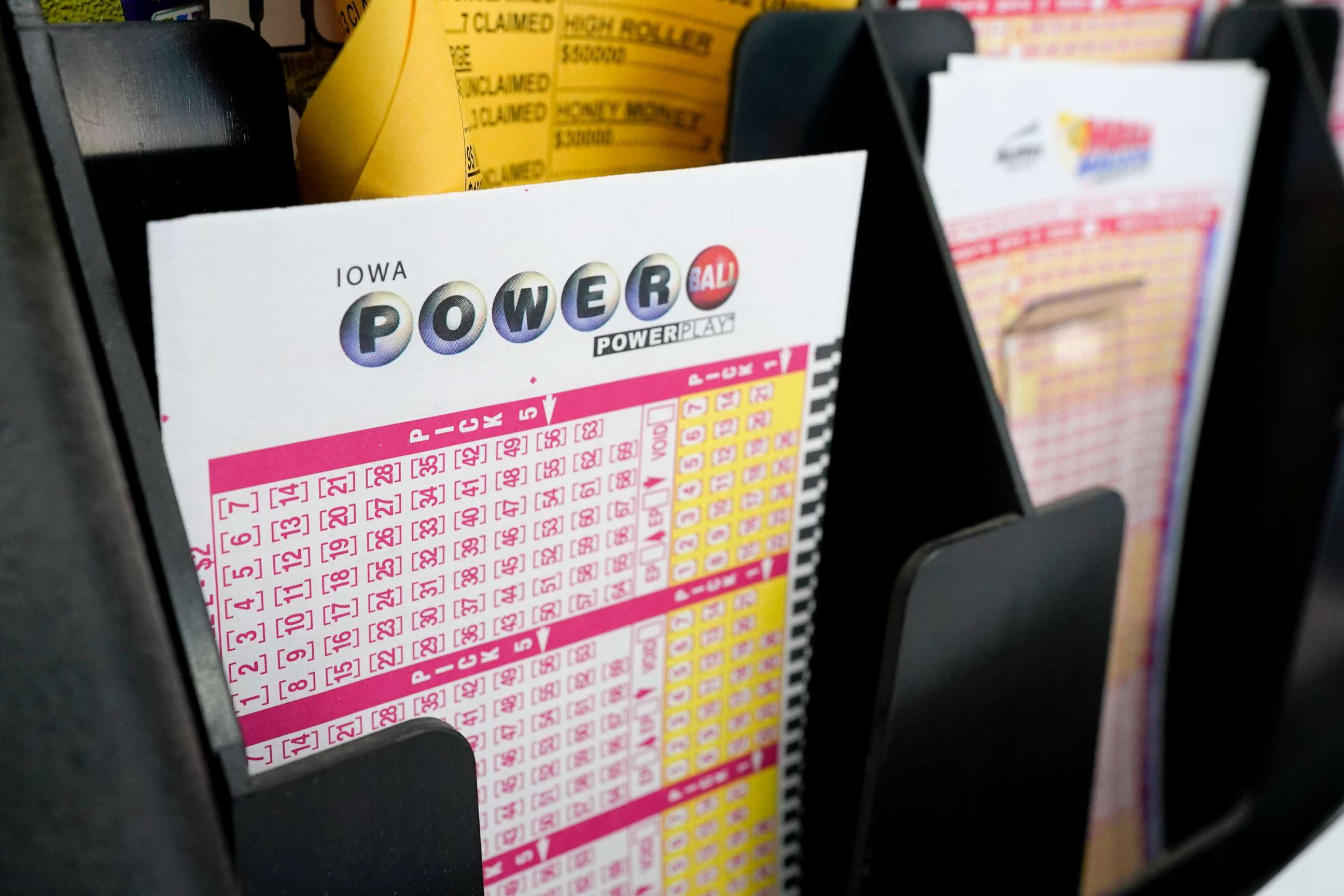 PHOTO: Blank forms for the Powerball lottery sit in a bin at a local grocery store, in Des Moines, Iowa, Jan. 12, 2021.