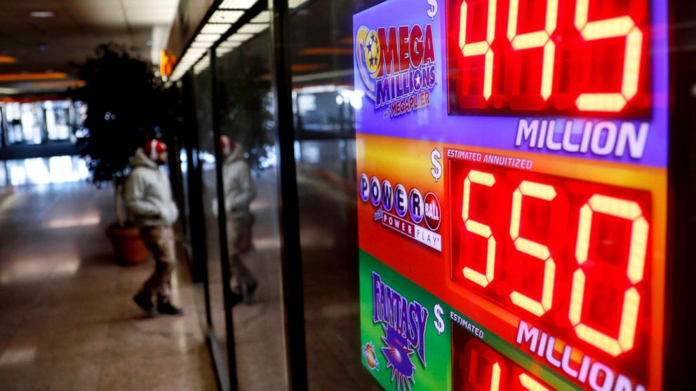A sign advertises Powerball and Mega Millions lottery jackpots at a store in Atlanta, Jan. 4, 2018. 
