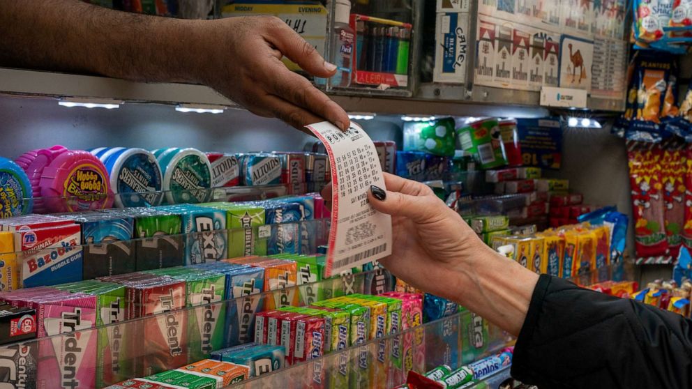 PHOTO: A person purchases a Powerball ticket on November 4, 2022 in New York City.